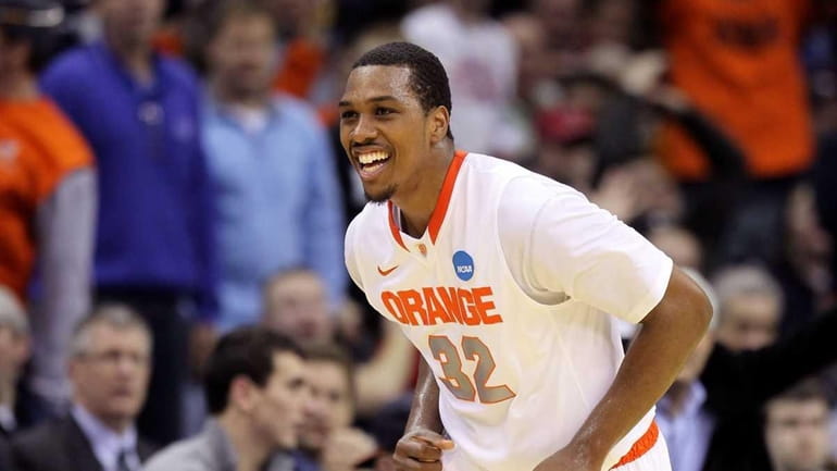 Kris Joseph #32 of the Syracuse Orange reacts after a...