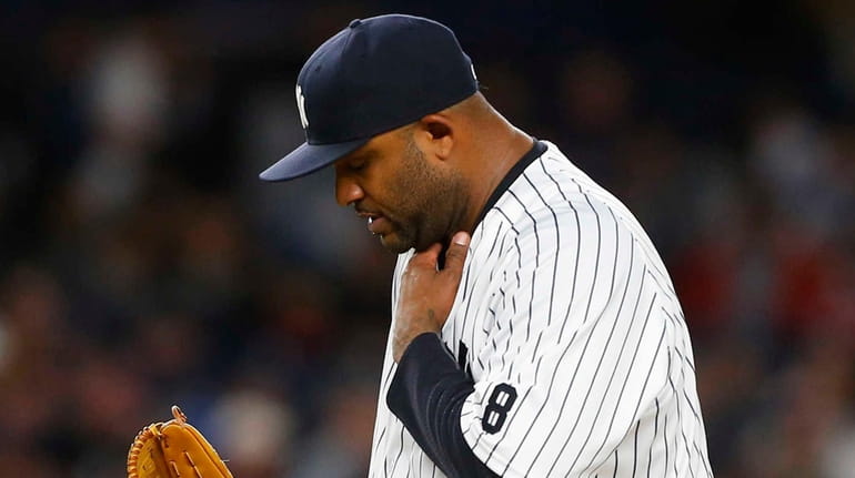 CC Sabathia #52 of the New York Yankees stands on...
