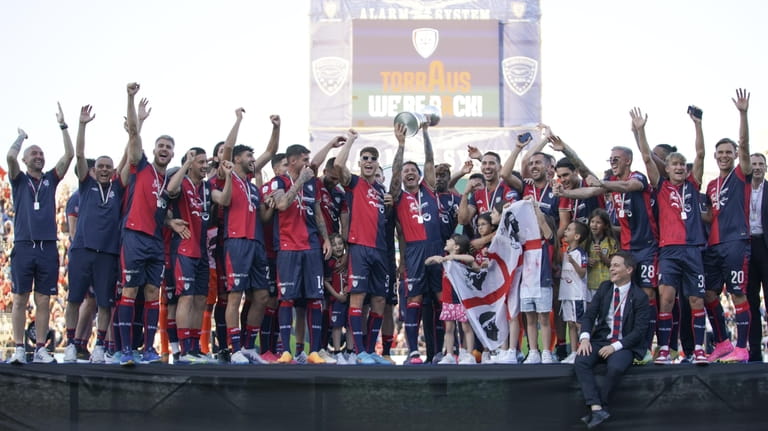 Cagliari players celebrate being promoted to Serie A on June...