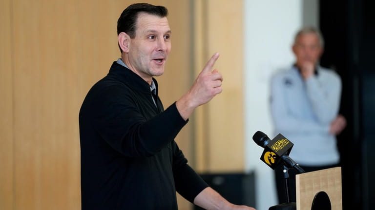 New Iowa offensive coordinator Tim Lester speaks during an NCAA...