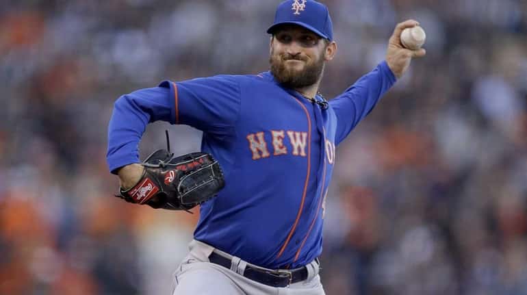 Jon Niese pitches for the Mets against the Giants in...