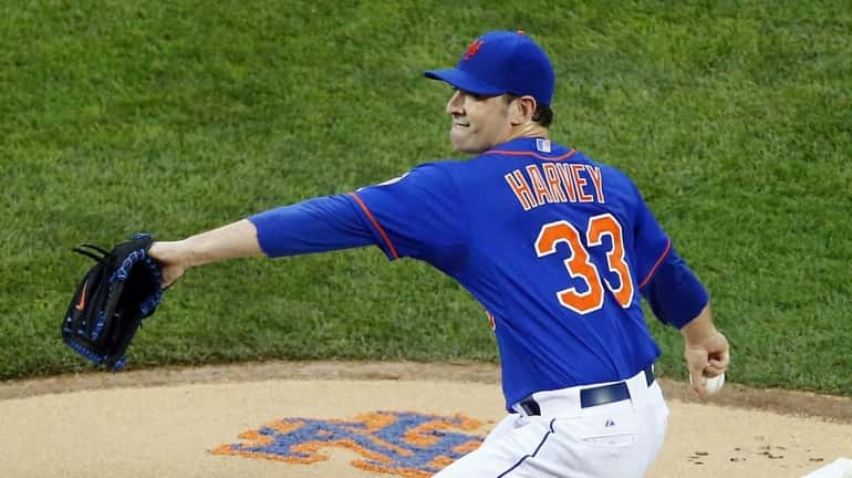 Matt Harvey of the Mets pitches against the Washington Nationals...