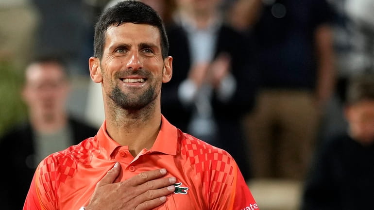 Serbia's Novak Djokovic celebrates after beating Hungary's Marton Fucsovics during...