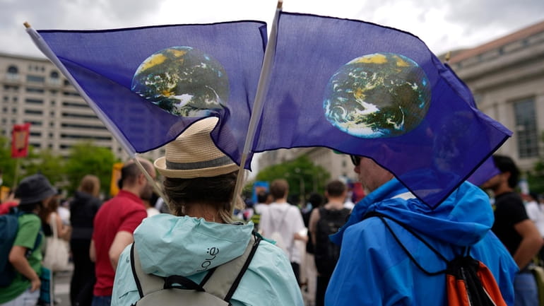 Climate activists hold a rally to protest the use of...