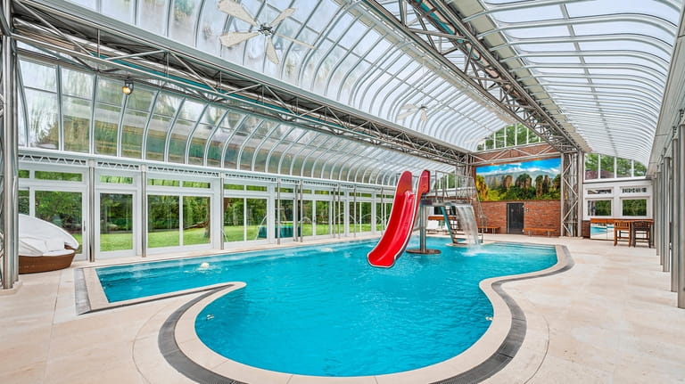 2. The home features an indoor pool with water slide.