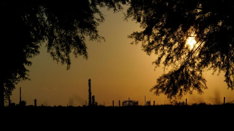 The Denka Performance Elastomer Plant sits at sunset in Reserve,...