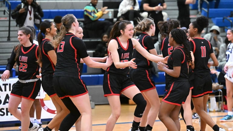 Long Island Luteran players celebrate 99-58 win against Saint Mary's...