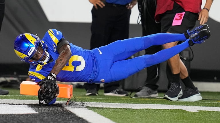 Los Angeles Rams wide receiver Tutu Atwell dives for the...