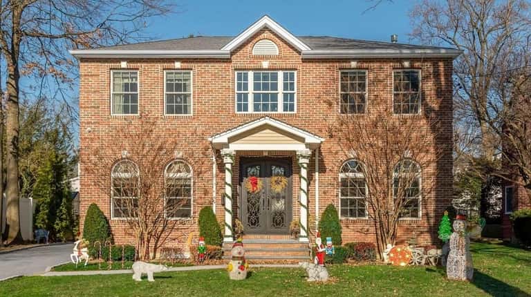 Priced at $1.95 million, this center-hall Colonial on Beverly Drive...