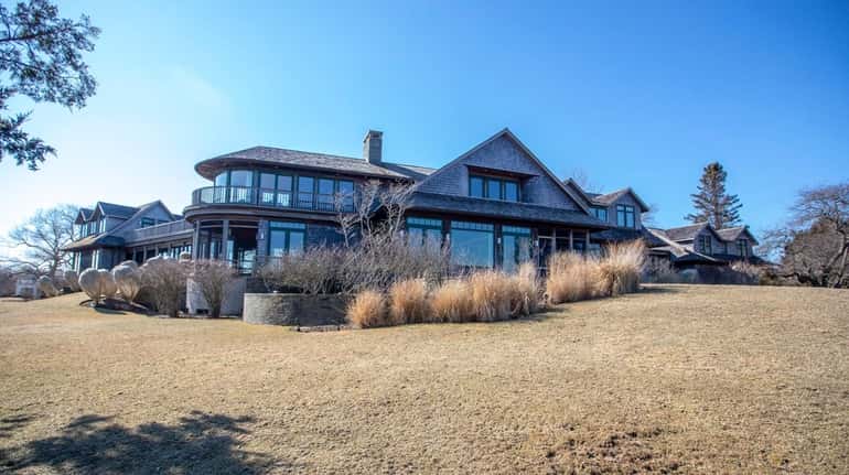 This seven-bedroom home on 1.46 acres in Water Mill, with water on...