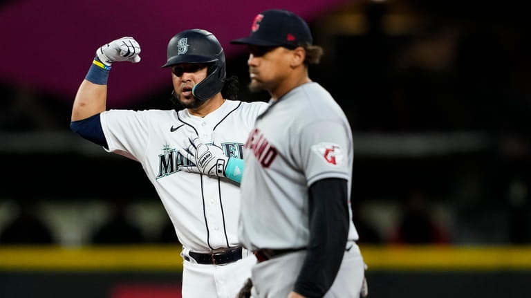 Seattle Mariners' Eugenio Suarez gestures after hitting a double against...