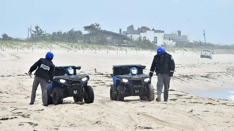 New York State police search Wainscott Beach on Sunday, looking...