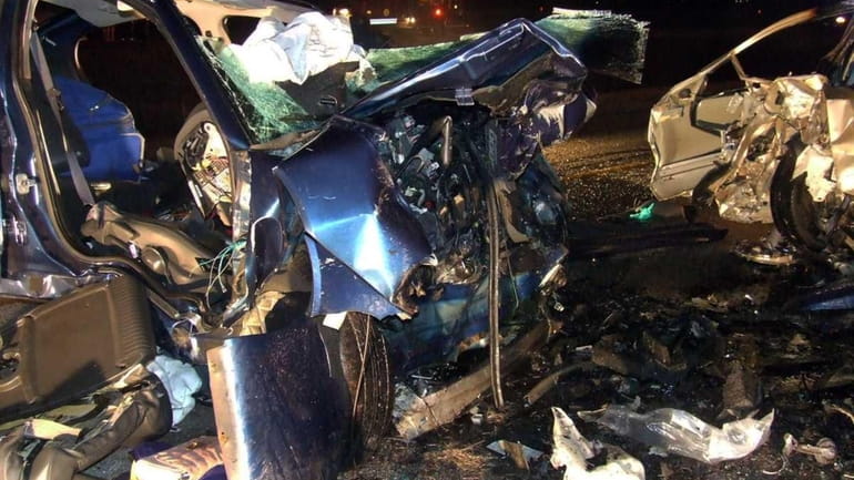The wreckage of vehicles involved in the fatal accident that...