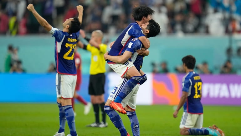 Japan players jubilate at the end of the World Cup...