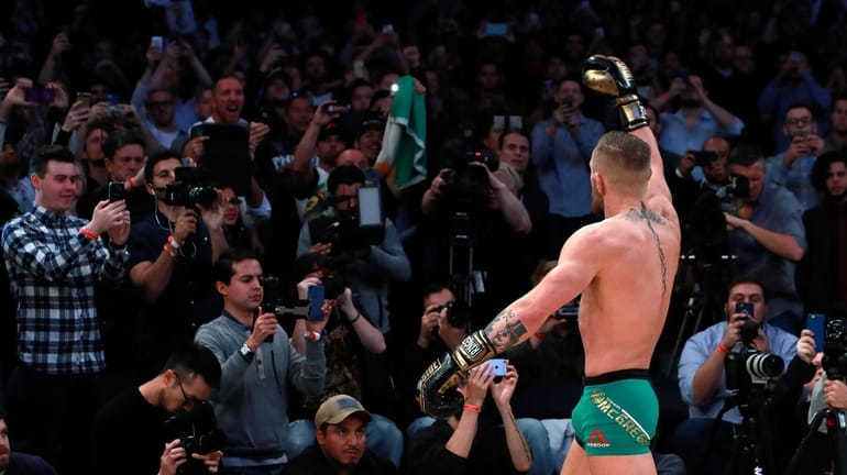 Conor McGregor motions to the crowd during UFC 205 Open...