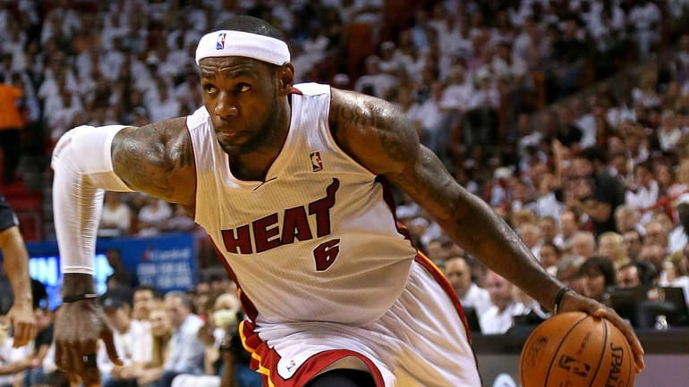 LeBron James of the Miami Heat drives during Game 2...