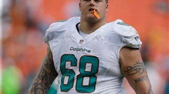 Miami Dolphins guard Richie Incognito is seen on the sidelines...