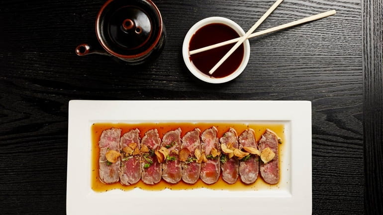 Beef tiradito-style carpaccio is served at Nikkei of Peru in...