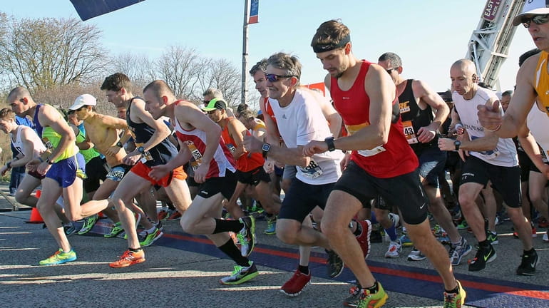 Runners cross the starting line of the 2015 Long Island...
