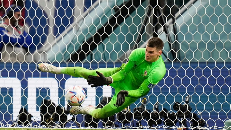 Croatia's goalkeeper Dominik Livakovic makes a save during the penalties...