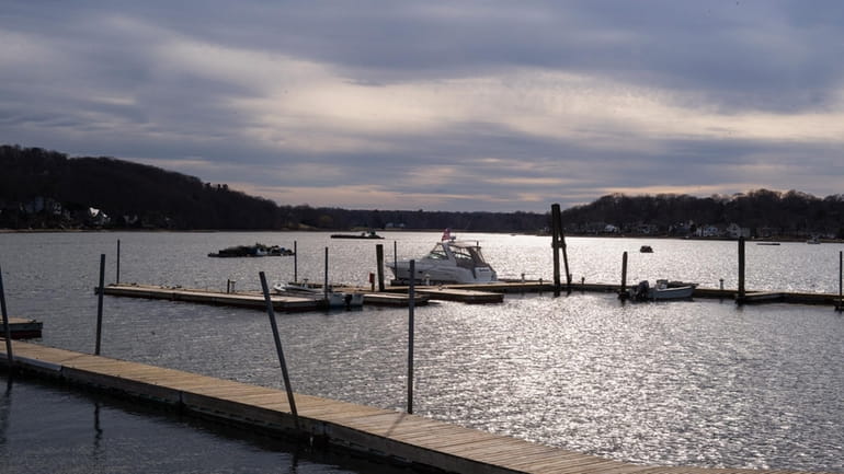 Boats docked in early spring at Bridge Marine Sales and...