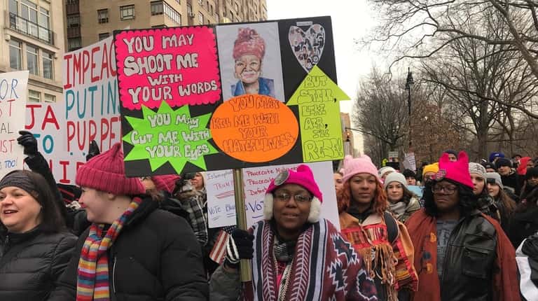A'riel Hart of Suffolk County, center, at the Women's March...