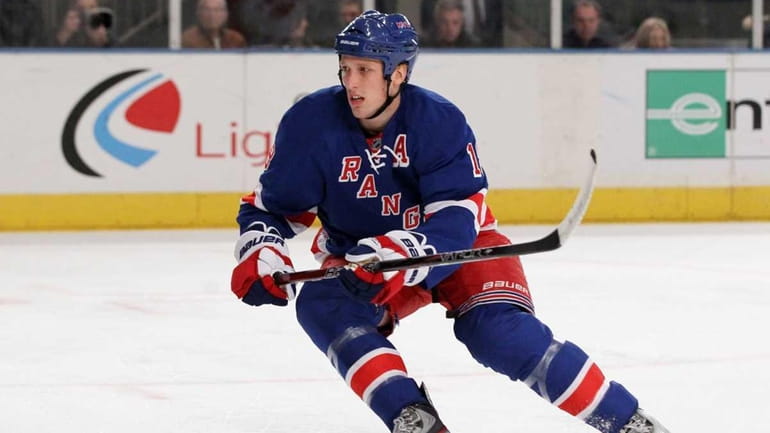 Marc Staal #18 of the New York Rangers skates against...