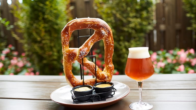 The Garden Social Ale and a pretzel with mustard and...