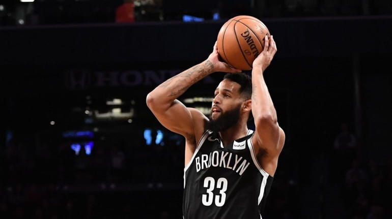 Nets forward Allen Crabbe shoots for a three-point basket against...