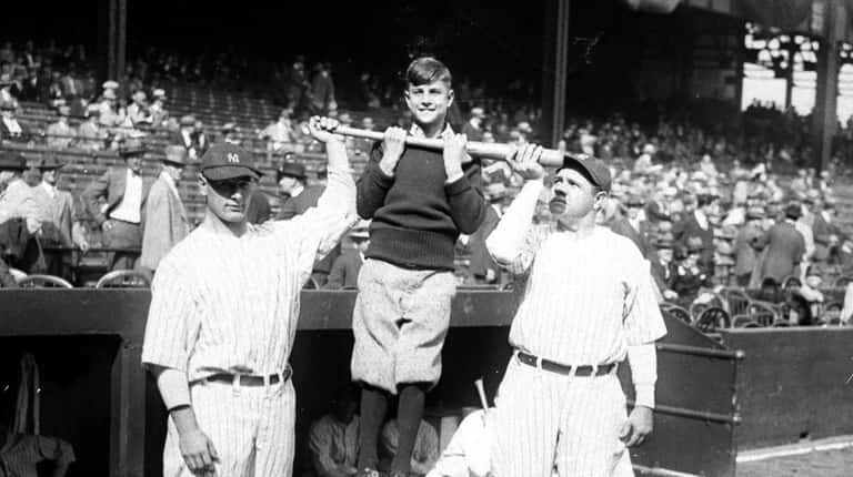New York Yankees Lou Gehrig, left, and Babe Ruth holding...