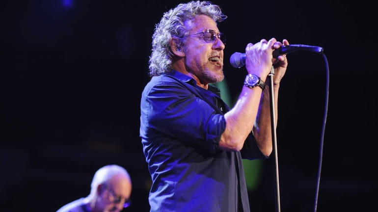 Singer Roger Daltrey performs with The Who as the band...