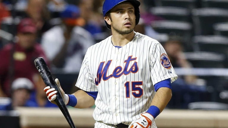 Travis d'Arnaud #15 of the Mets strikes out to end...