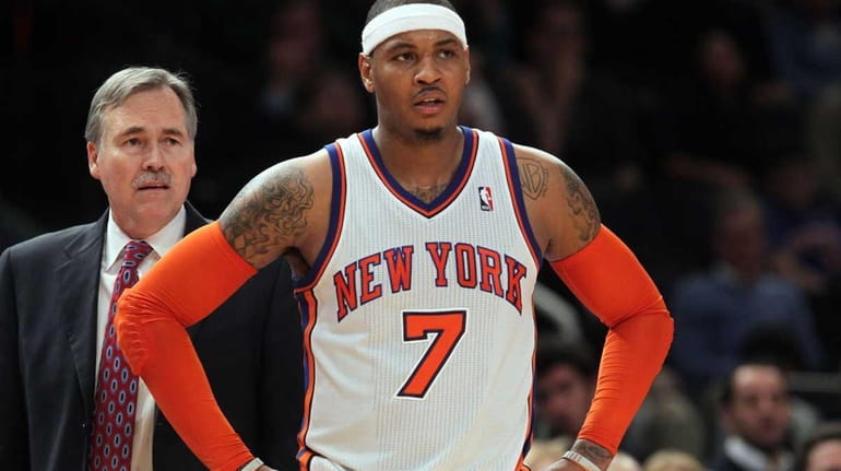 Carmelo Anthony #7 and head coach Mike D'Antoni of the...