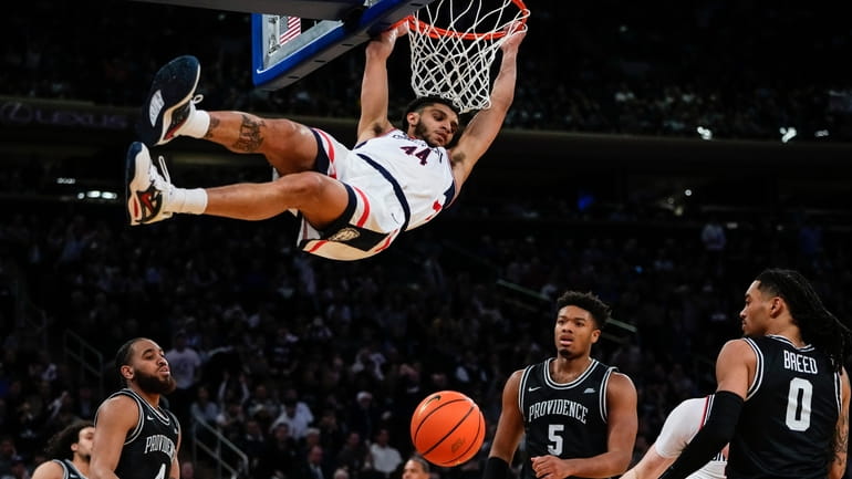 Connecticut's Andre Jackson Jr. (44) dunks the ball in front...