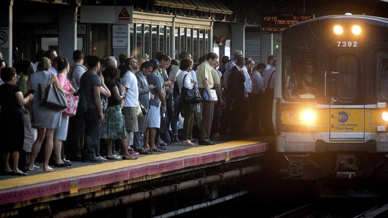 LIRR commuters wait for their train to come in at...