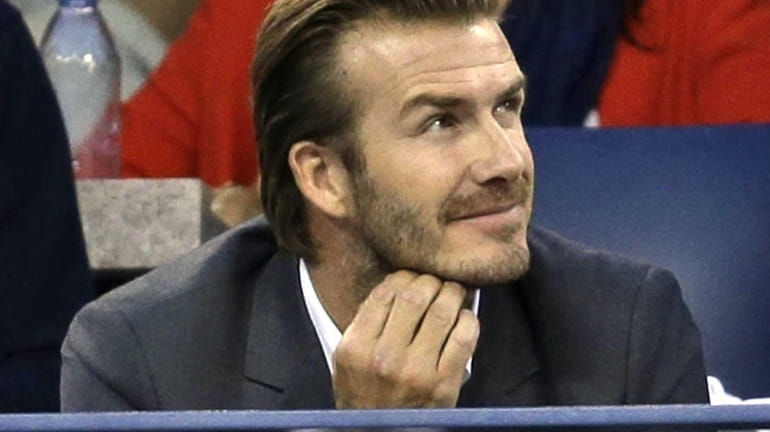 David Beckham watches play between Rafael Nadal and Novak Djokovic...