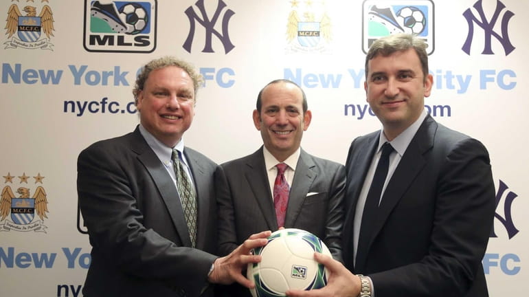From left, Yankees president Randy Levine, Major League Soccer Commissioner...