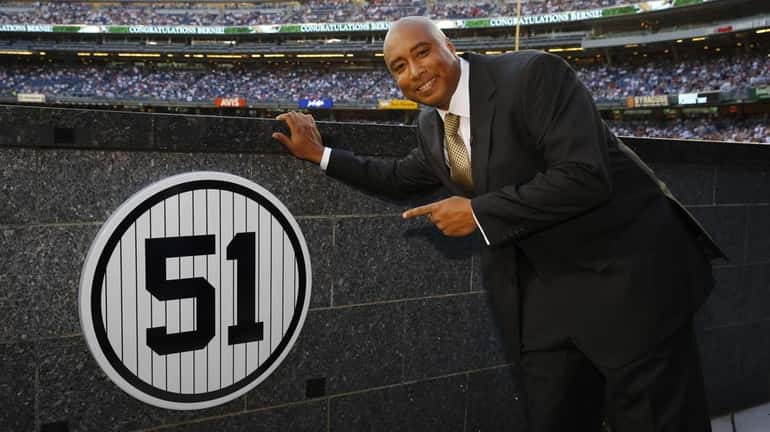 Former New York Yankees centerfielder Bernie Williams points to his...