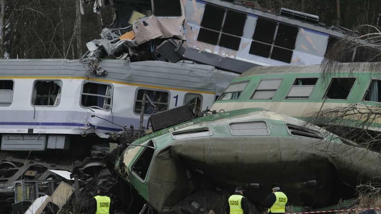 The wreckage of collided trains lies, in Szczekociny, southern Poland....