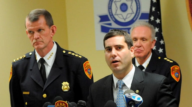 Suffolk Deputy Police Commissioner Tim Sini at a news conference...