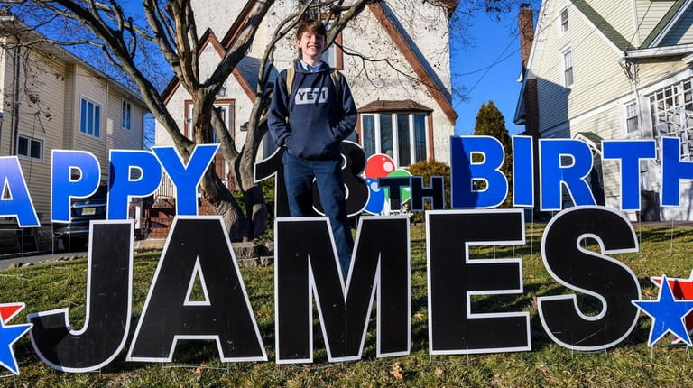 James Culhane poses with a giant "Happy 18th Birthday James"...