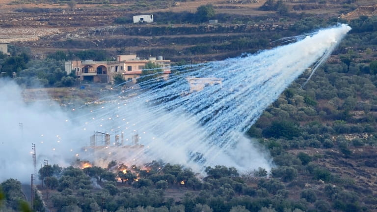 A shell that appears to be white phosphorus from Israeli...