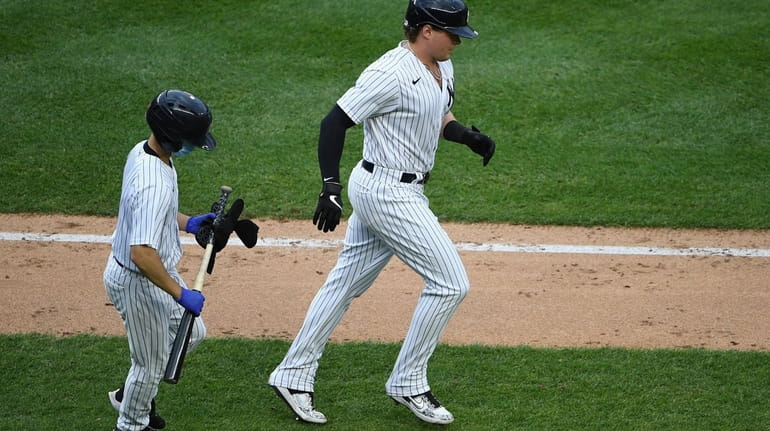 Yankees designated hitter Luke Voit draws a walk against the...