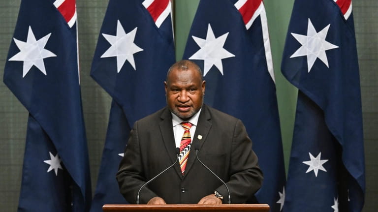 Papua New Guinea's Prime Minister James Marape addresses members and...