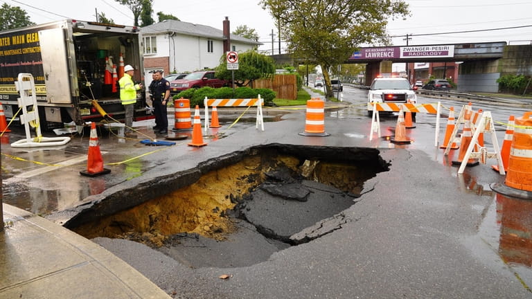 A 10-foot by 12-foot sinkhole developed at Peninsula Boulevard and...