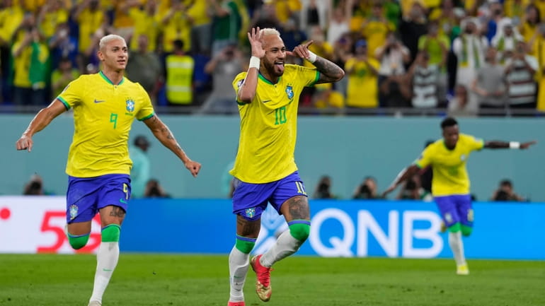 Brazil's Neymar celebrates after scoring his side's second goal during...
