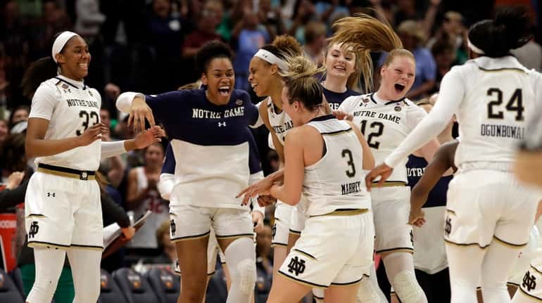 Notre Dame celebrates at the end of an NCAA Women's...