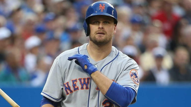 Lucas Duda of the New York Mets reacts after striking...