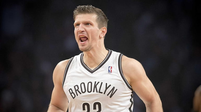 Nets' Mirza Teletovic reacts after hitting a three-pointer against the...