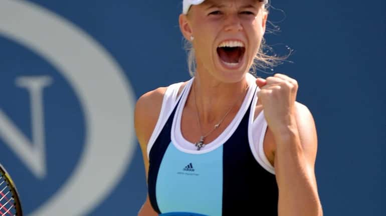 Caroline Wozniacki celebrates a win over Ying-Ying Duan during their...